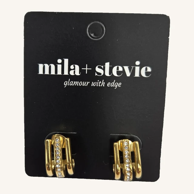 One pair of Sadie gold-tone triple-strand CZ earrings on the original mila+stevie card