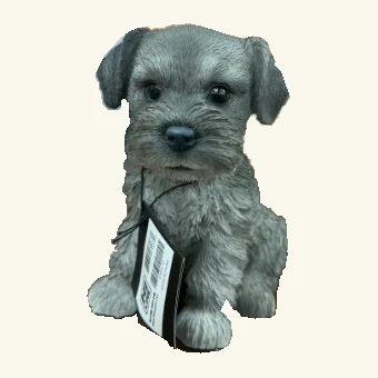 Gray schnauzer puppy figurine with folded ears, a bearded muzzle, textured fur and its original hanging barcode tag and cord.