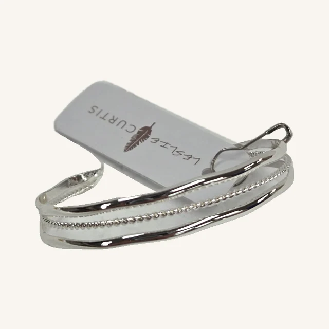 Shania silver-tone open cuff with smooth bands, rope-textured center and original attached tag