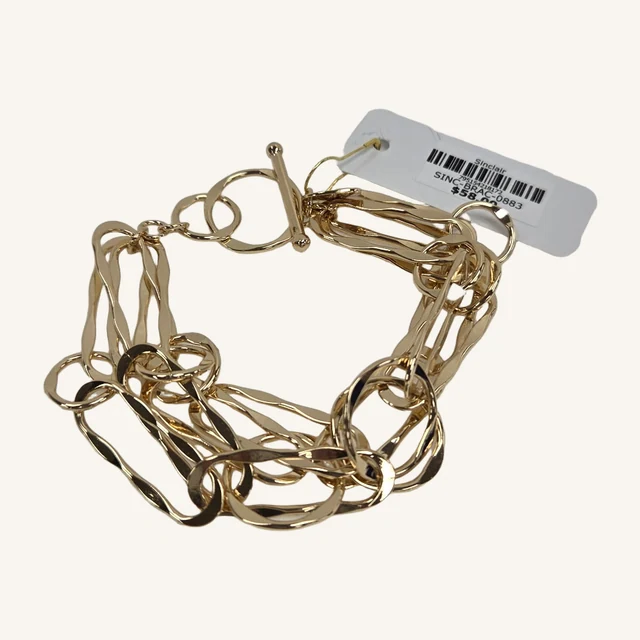 Actual Sinclair triple-layer gold-tone link bracelet with its original toggle clasp, connector rings and printed tag