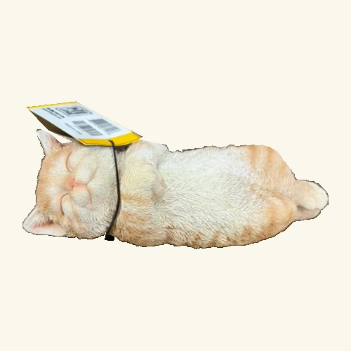 Sleeping orange cat figurine with its original hang tag and cord.