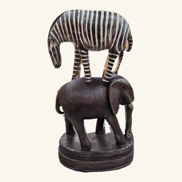 Complete zebra-and-elephant sculpture with original stripe pattern, tail, legs, trunk and decorated round base
