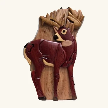 Standing deer puzzle box with antlers, reddish-brown body, pale accents, visible fitted seams, and a tree-shaped backdrop.