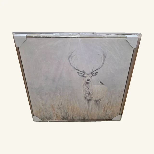 Starlight Stag II. A pale stag emerges from quiet grasses in a softly textured, neutral-toned wildlife portrait.