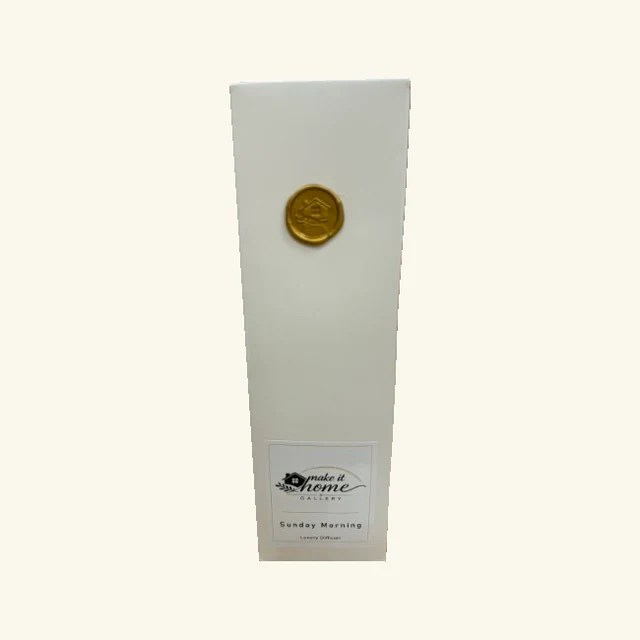 Original white Sunday Morning diffuser retail box with gold gallery seal and labeled front