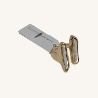 Tanner open gold-tone ring with its actual elongated white resin stones and Leslie Curtis tag