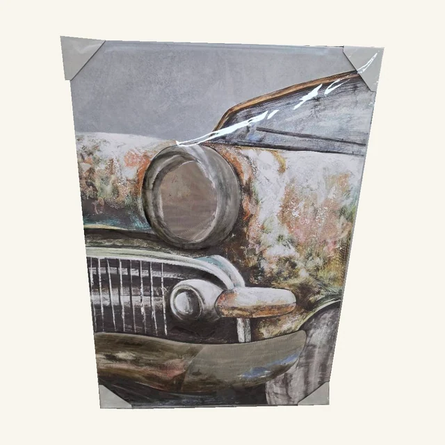 Timeworn Beauty. The rounded headlight and weathered finish of a vintage car give this piece its nostalgic character.