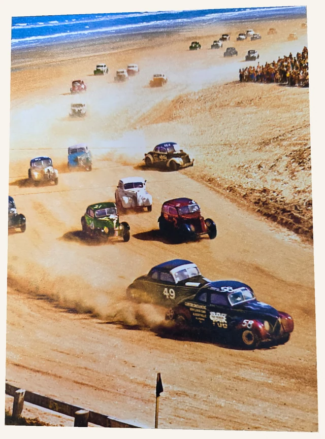 The actual birthday card front showing vintage stock cars racing along a beach.