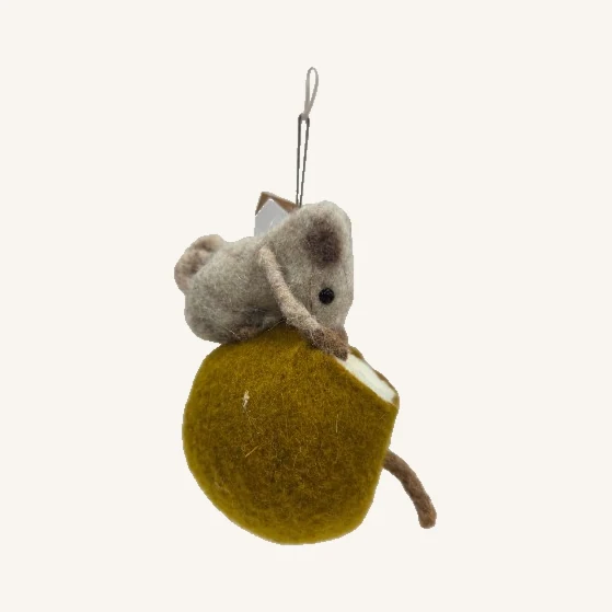 Gray felt mouse on mustard-yellow fruit with its real tail, hanging loop and folded tag